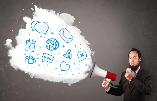 Man shouting into loudspeaker and modern blue icons and symbols — Stock Photo, Image