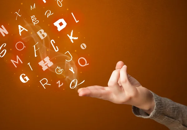 Letters coming out of gun shaped hands — Stock Photo, Image