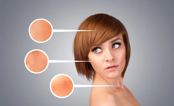 Beautiful young girl with facial care arrow signs of damaged ski — Stock Photo, Image