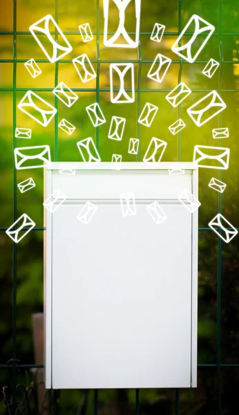 Mailbox with letter icons on glowing green background — Stock Photo, Image