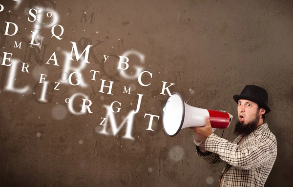 Man in shirt shouting into megaphone and text come out — Stock Photo, Image