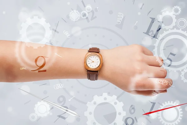 Hand with watch and numbers on the side comming out — Stock Photo, Image