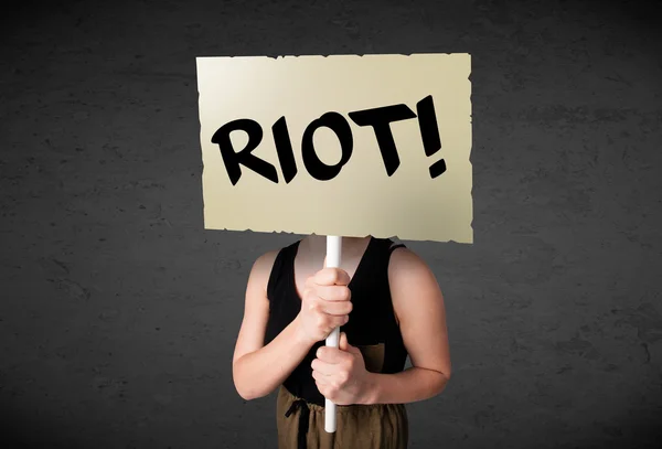 Young woman holding a protest sign — Stock Photo, Image