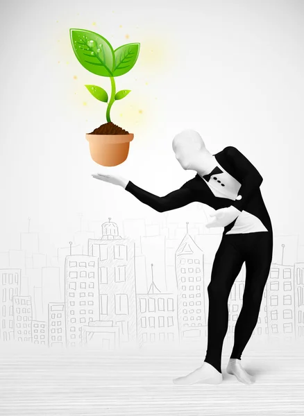 Man in full body suit with eco plant — Stock Photo, Image