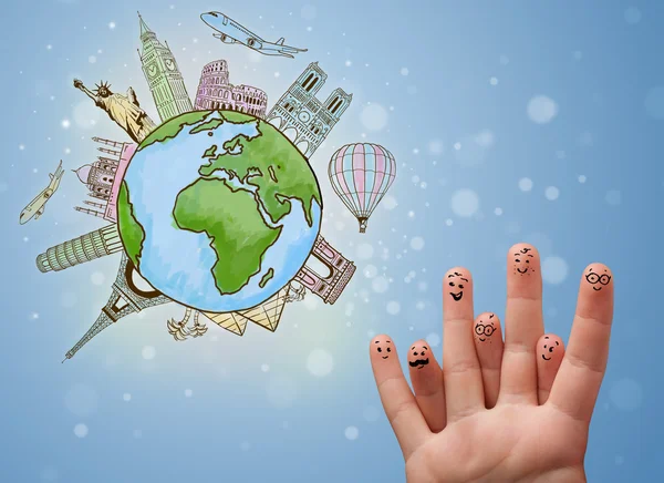 Cheerful finger smileys with famous landmarks of the globe — Stock Photo, Image