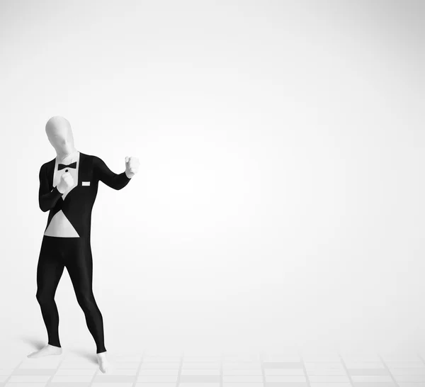 Grappige man in morphsuit body suit op zoek naar kopieerruimte — Stockfoto