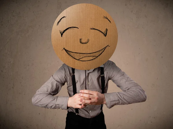 Businessman holding a smiley face board Royalty Free Stock Photos