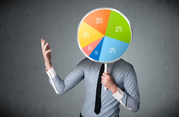 Businessman holding a pie chart — Stock Photo, Image