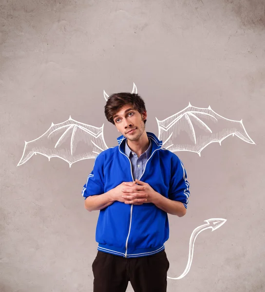 Young man with devil horns and wings drawing — Stock Photo, Image