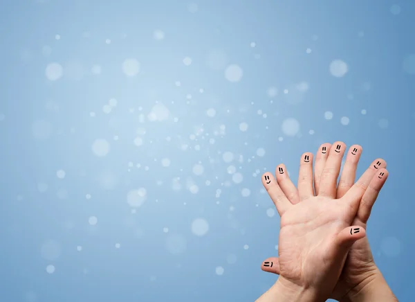 Happy Finger Smileys mit leerem blauen Bokeh Hintergrund — Stockfoto