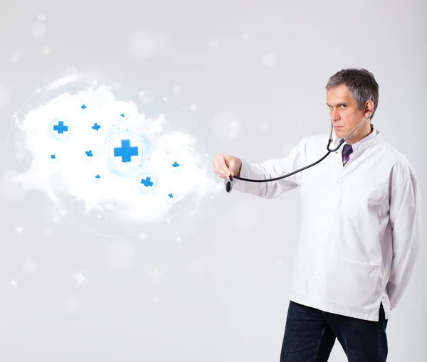 Doctor listening to abstract cloud with medical signs — Stock Photo, Image