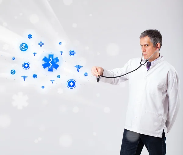 Doctor with blue medical icons — Stock Photo, Image