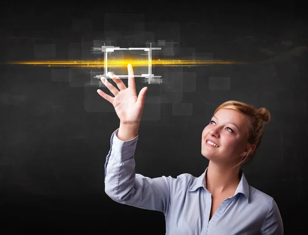 Jonge tech dame aanraken knop met oranje lichtstralen concept — Stockfoto