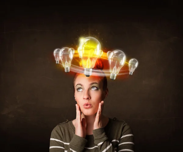 Woman with light bulbs circleing around her head — Stock Photo, Image