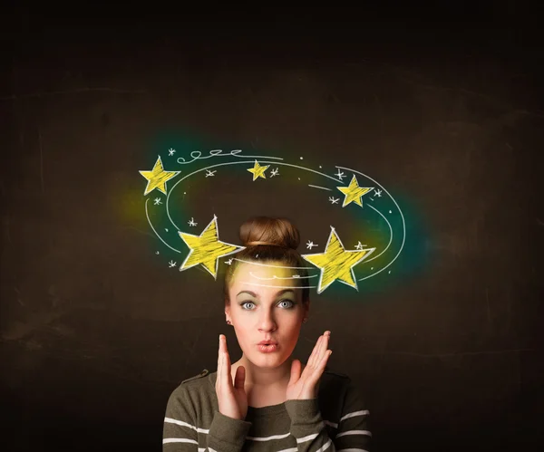 Dívka se žlutými hvězdami krouží kolem její hlavy ilustrace — Stock fotografie