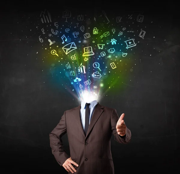 Business man with glowing media icons exploding head — Stock Photo, Image