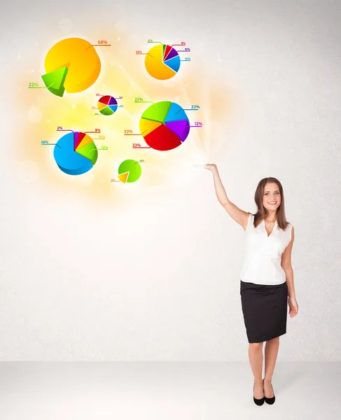 Business woman with colorful graphs and charts — Stock Photo, Image