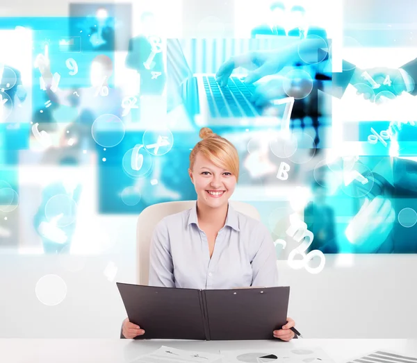 Business person at desk with modern tech images at background — Stock Photo, Image