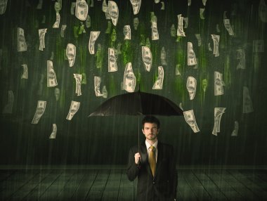 Bir dolar yağmur konseptinde şemsiyesi olan bir iş adamı