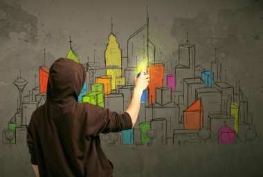 Genç şehir ressamı çiziyor