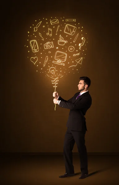 Businessman with a social media balloon — Stock Photo, Image