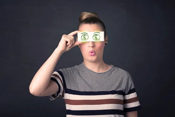 Fiatal lány gazdaság papír zöld dollár jel — Stock Fotó