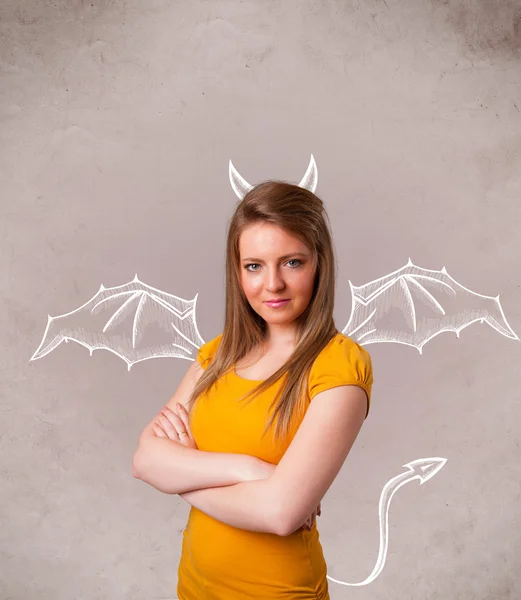 Young girl with devil horns and wings drawing — Stock Photo, Image