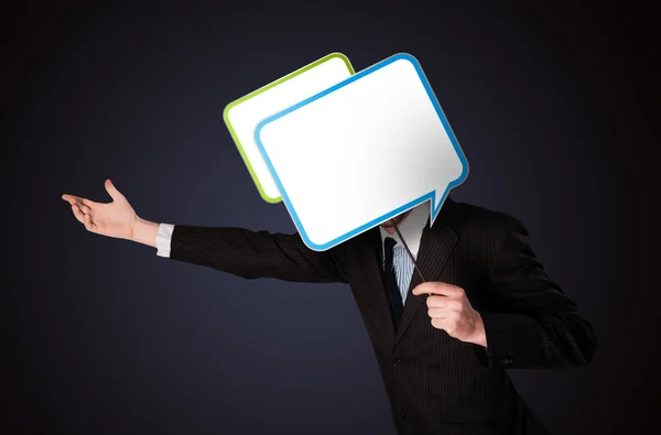 Businessman holding speech bubble — Stock Photo, Image