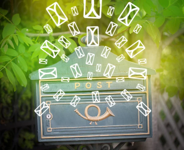 Mailbox with letter icons on glowing green background — Stock Photo, Image