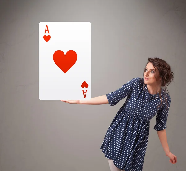 Beautifu woman holding a red heart ace — Stock Photo, Image