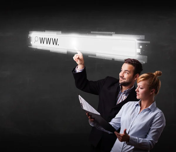 Joven pareja de negocios tocando la barra de direcciones del navegador web con www —  Fotos de Stock