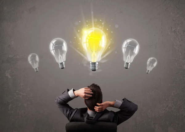 Business person having an idea light bulb concept — Stock Photo, Image