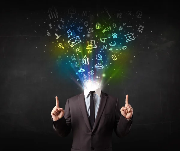 Business man with glowing media icons exploding head — Stock Photo, Image