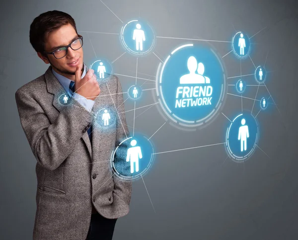 Handsome man looking at modern social network — Stock Photo, Image