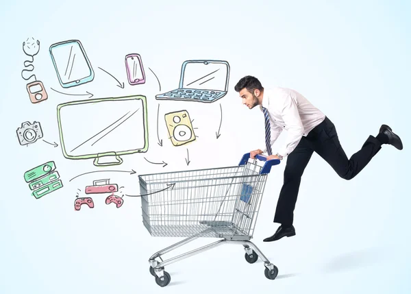 Businessman with shopping cart — Stock Photo, Image