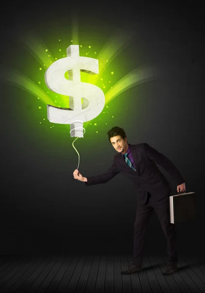 Businessman with a dollar sign balloon — Stock Photo, Image