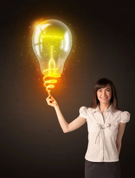 Businesswoman with an idea bulb — Stock Photo, Image