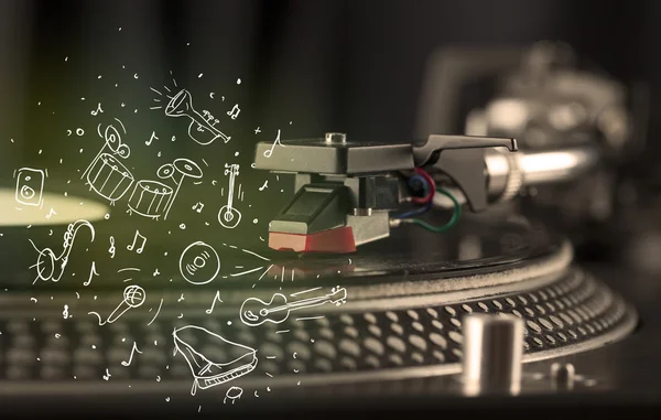 Turntable playing classical music with icon drawn instruments — Stock Photo, Image