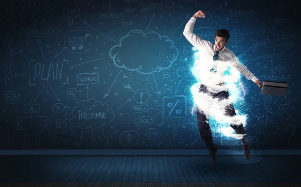 Happy business man jumping with storm cloud around him — Stock Photo, Image