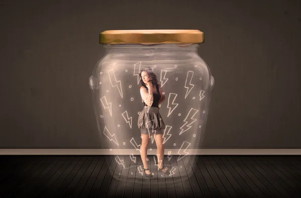Businesswoman inside a glass jar with lightning drawings concept — Stock Photo, Image