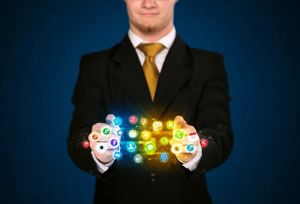 Businessman holding app icon cloud — Stock Photo, Image