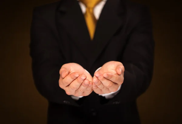 Businessman holding something — Stock Photo, Image