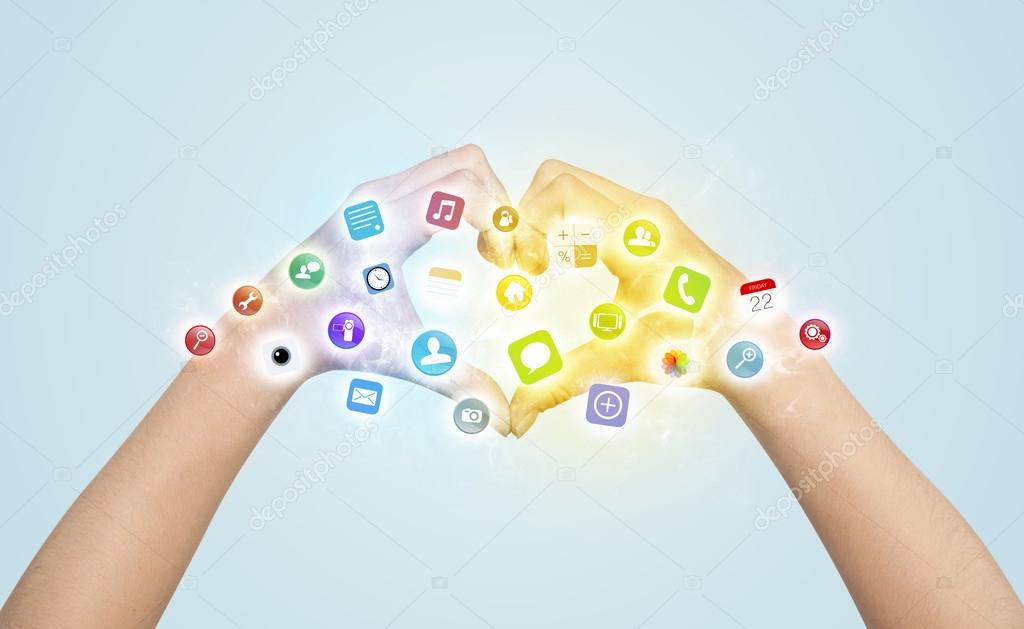 Hands creating a form with mobile app icons