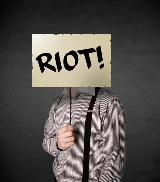 Businessman holding a protest sign — Stock Photo, Image