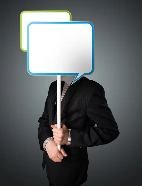 Businessman holding speech bubble — Stock Photo, Image