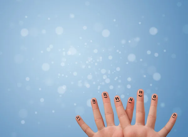 Happy finger smileys avec fond bleu bokeh vide — Photo