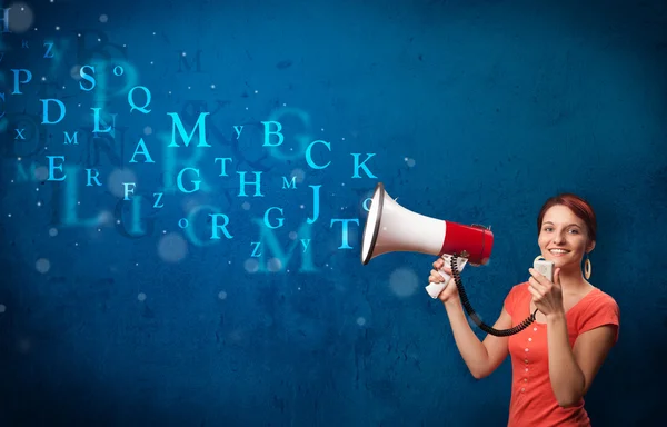 Young girl shouting into megaphone and text come out — Stock Photo, Image
