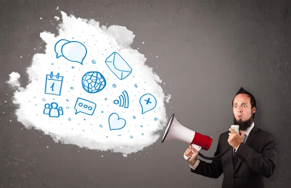 Man shouting into loudspeaker and modern blue icons and symbols — Stock Photo, Image