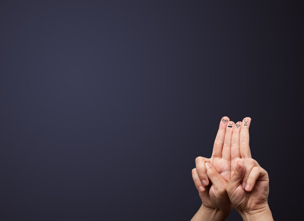 Happy smiley fingers looking at empty wall copyspace