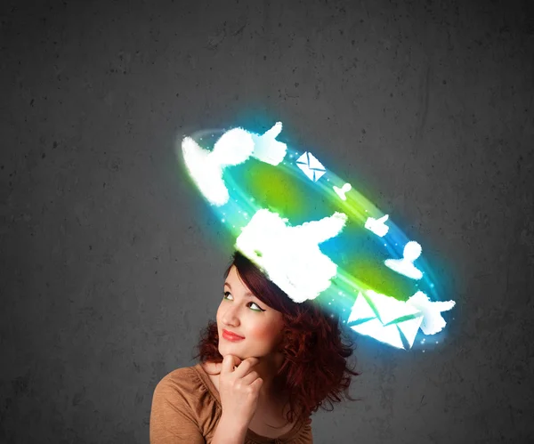 Young teenager with cloud social icons around her head — Stock Photo, Image